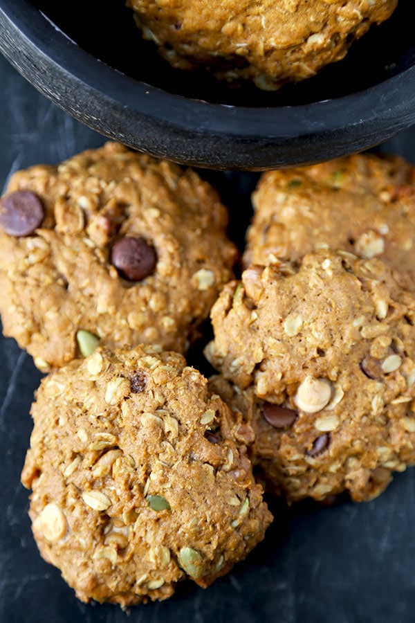 Pumpkin Oatmeal Cookies - These healthier Pumpkin Oatmeal Cookies are one part gooey oatmeal chocolate chip cookie, one part pumpkin pie. Ready in 25 minutes from start to finish! Recipe, cookies, dessert, healthy snack, baking | pickledplum.com