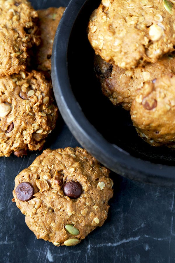 Pumpkin Oatmeal Cookies - These healthier Pumpkin Oatmeal Cookies are one part gooey oatmeal chocolate chip cookie, one part pumpkin pie. Ready in 25 minutes from start to finish! Recipe, cookies, dessert, healthy snack, baking | pickledplum.com