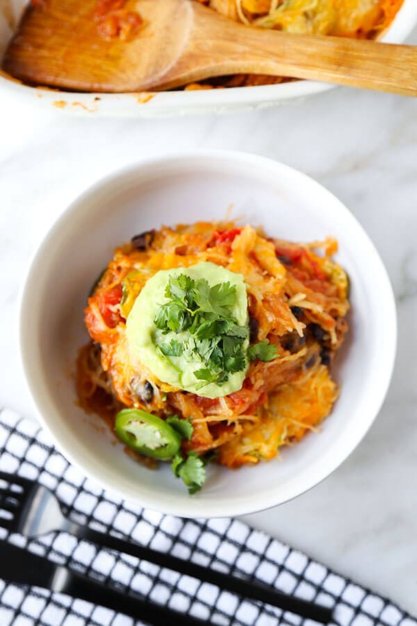 Mexican Spaghetti Squash Casserole - With the colors of autumn and peppy, south-of-the-border flavor, this Mexican Spaghetti Squash Casserole With Avocado Salsa Recipe is healthy dinner perfection! Recipe, healthy, dinner, main, casserole | pickledplum.com