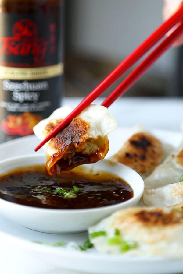 Shrimp Gyoza (Pan-Fried Dumplings) - Pillowy and tender pan-fried shrimp gyoza served with a fiery Szechuan spicy sauce. Recipe, dumplings, appetizer, snack, shrimp, gyoza | pickledplum.com