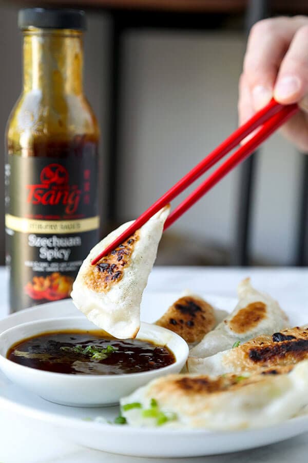 Shrimp Gyoza (Pan-Fried Dumplings) - Pillowy and tender pan-fried shrimp gyoza served with a fiery Szechuan spicy sauce. Recipe, dumplings, appetizer, snack, shrimp, gyoza | pickledplum.com