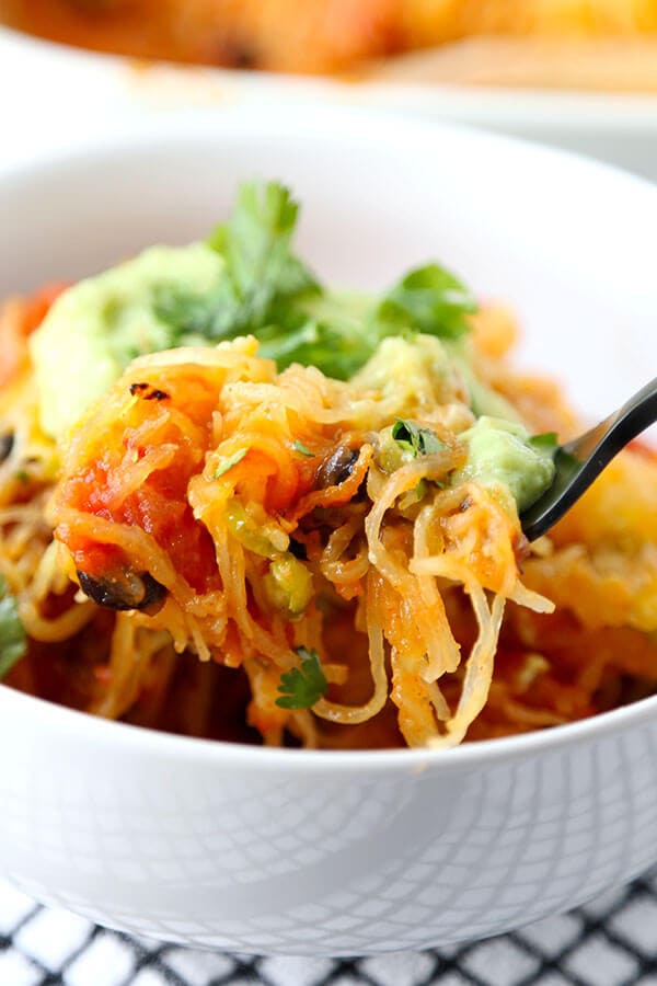 Mexican Spaghetti Squash Casserole - With the colors of autumn and peppy, south-of-the-border flavor, this Mexican Spaghetti Squash Casserole With Avocado Salsa Recipe is healthy dinner perfection! Recipe, healthy, dinner, main, casserole | pickledplum.com