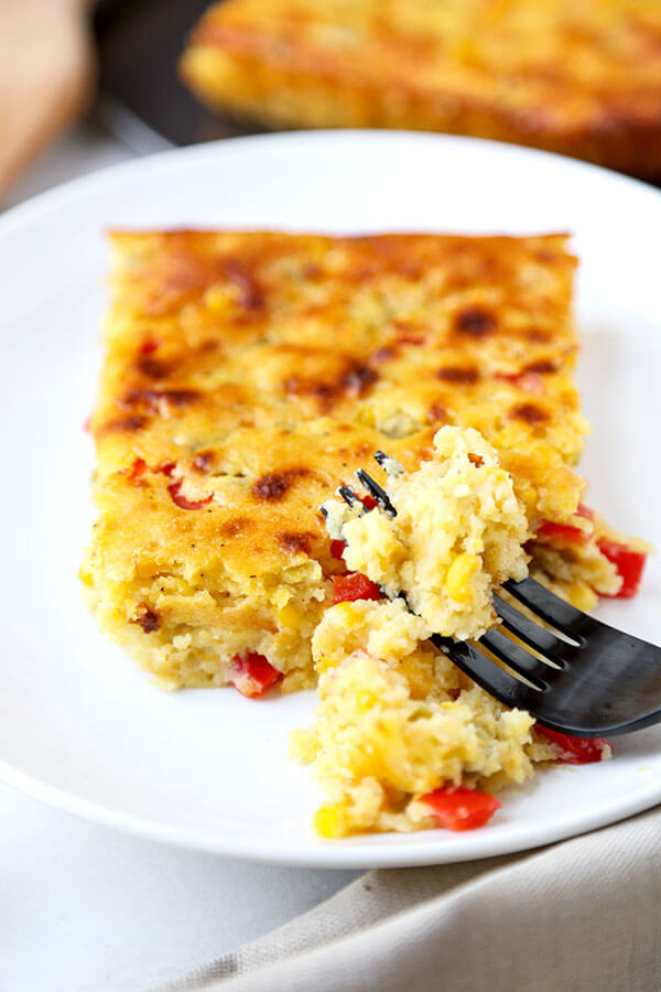 Lightened Up Corn Casserole - This Lightened Up Corn Casserole Recipe has the spirit of cornbread with the soul of a creamy autumn casserole. Ready in 40 minutes from start to finish! Recipe, Thanksgiving, Christmas, corn, side dish, baking | pickledplum.com