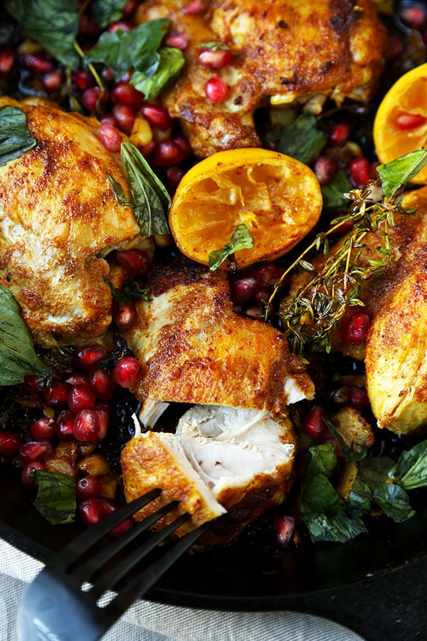 Curried Chicken With Pomegranate - Juicy curried chicken served with fresh basil, pomegranate and loads of pan fried garlic bits. Amazing and so easy! Ready in less than 25 minutes. Recipe, chicken, poultry, curry, dinner, easy meal, pomegranate, lemon | pickledplum.com