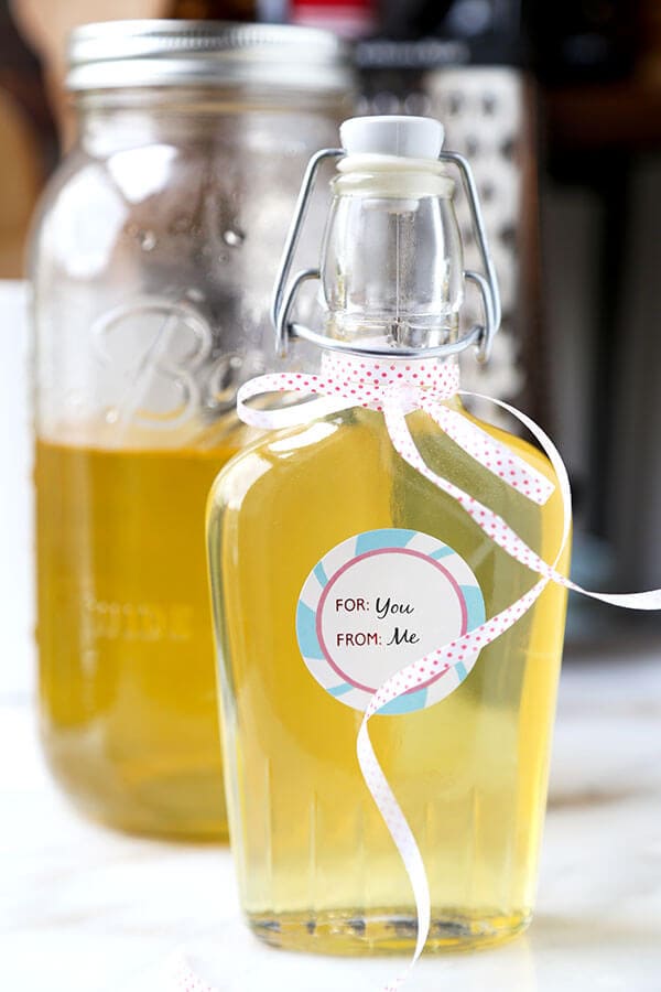 Limoncello - Make your own Limoncello this holiday season with just 3 ingredients! Serve it with soda and a splash of cranberry juice or bottle it up for the cutest and cheeriest homemade gift! Recipe, how to make limoncello, diy, alcohol, cocktail, vodka, drink | pickledplum.com