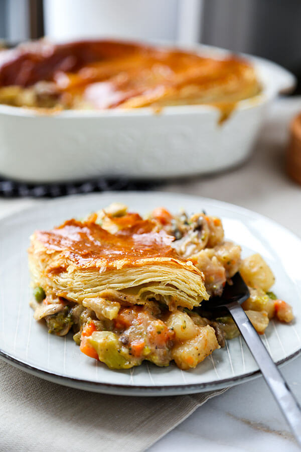 Hearty Vegetable Pot Pie - This hearty vegetable pot pie with creamy mushroom sauce and topped with puff pastry is guaranteed to keep you warm this winter! Recipe, dinner, vegetables, baking, pie | pickledplum.com