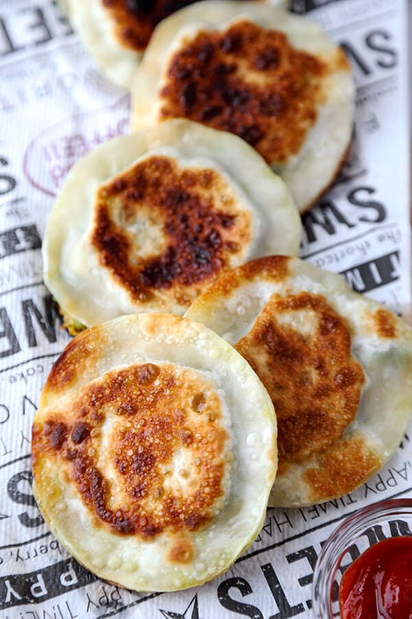 Avocado & Cheese Dumplings - Easy, crispy, creamy, pillowy avocado and cheese dumplings that are so delicious, you won't be able to stop at just one! Ready in 10 minutes, gone in less! Recipe, snack, dumpling, gyoza, avocado, appetizer | pickledplum.com