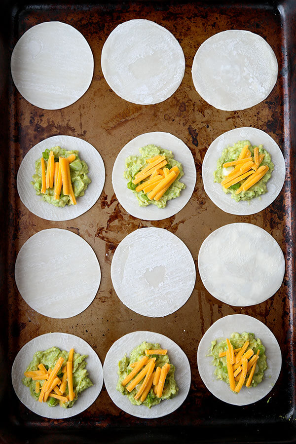 Avocado & Cheese Dumplings - Easy, crispy, creamy, pillowy avocado and cheese dumplings that are so delicious, you won't be able to stop at just one! Ready in 10 minutes, gone in less! Recipe, snack, dumpling, gyoza, avocado, appetizer | pickledplum.com