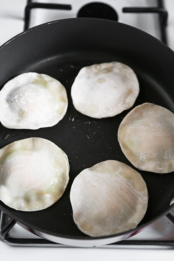 Avocado & Cheese Dumplings - Easy, crispy, creamy, pillowy avocado and cheese dumplings that are so delicious, you won't be able to stop at just one! Ready in 10 minutes, gone in less! Recipe, snack, dumpling, gyoza, avocado, appetizer | pickledplum.com