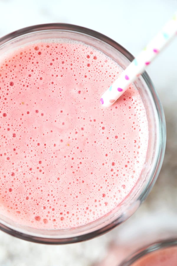 Strawberry Pineapple Coconut Smoothie - A morning pick me up with only three ingredients needed! This strawberry pineapple coconut smoothie is bright, refreshing and contains enough vitamin C to meet your daily RDA! Recipe, drink, smoothie, healthy, breakfast, fruits | pickledplum.com