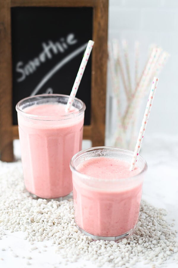 Strawberry Pineapple Coconut Smoothie - A morning pick me up with only three ingredients needed! This strawberry pineapple coconut smoothie is bright, refreshing and contains enough vitamin C to meet your daily RDA! Recipe, drink, smoothie, healthy, breakfast, fruits | pickledplum.com