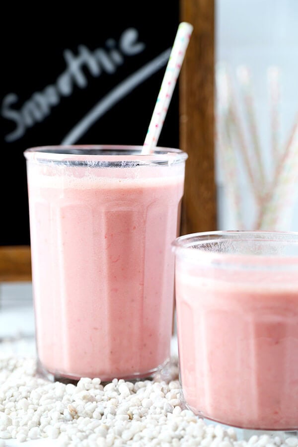 Strawberry Pineapple Coconut Smoothie - A morning pick me up with only three ingredients needed! This strawberry pineapple coconut smoothie is bright, refreshing and contains enough vitamin C to meet your daily RDA! Recipe, drink, smoothie, healthy, breakfast, fruits | pickledplum.com