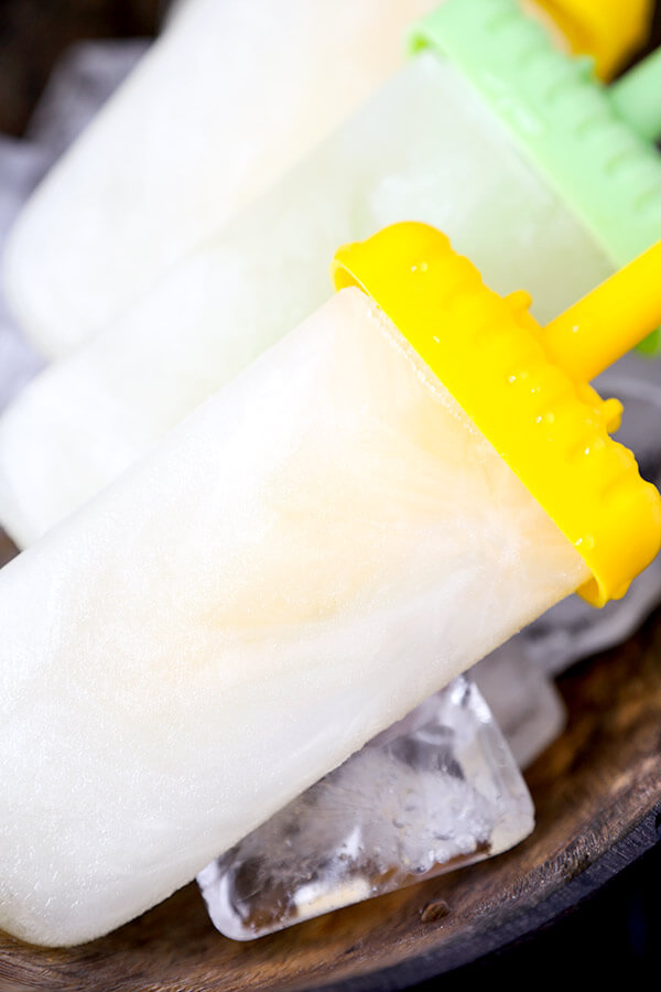 Lemon and Cava Popsicles - This is an easy recipe for light, sweet and tart popsicle that will give you a nice buzz all summer long! Recipe, dessert, ice pop, frozen treat, snack | pickledplum.com