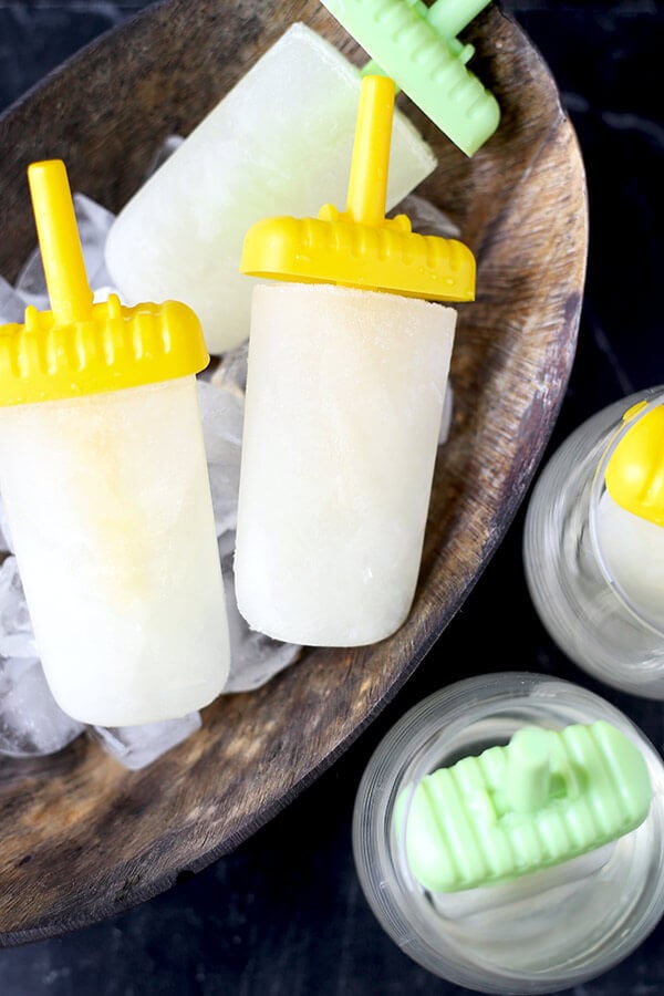 Lemon and Cava Popsicles - This is an easy recipe for light, sweet and tart popsicle that will give you a nice buzz all summer long! Recipe, dessert, ice pop, frozen treat, snack | pickledplum.com