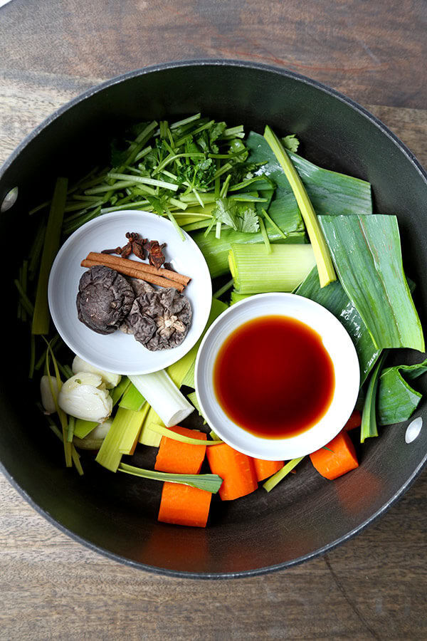 Vegetable Pho Broth - This is a mild yet fragrant vegetable pho broth recipe. Who says you need meat to make everything better? This vegan pho broth proves that veggies done well can taste spectacular! Recipe, vegan, vegetables, soup, pho, stock | pickledplum.com