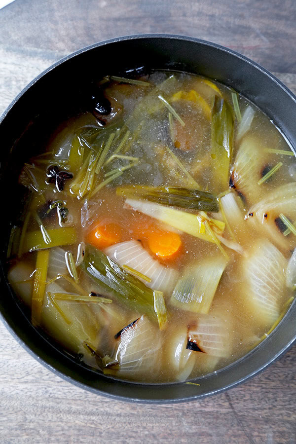 Vegetable Pho Broth - This is a mild yet fragrant vegetable pho broth recipe. Who says you need meat to make everything better? This vegan pho broth proves that veggies done well can taste spectacular! Recipe, vegan, vegetables, soup, pho, stock | pickledplum.com