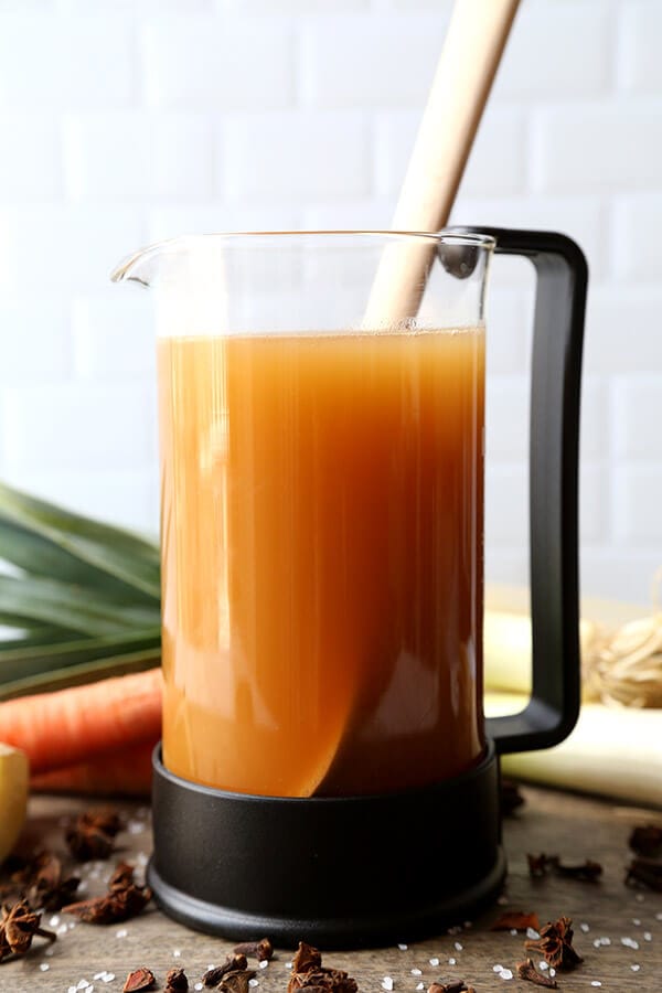 Vegetable Pho Broth - This is a mild yet fragrant vegetable pho broth recipe. Who says you need meat to make everything better? This vegan pho broth proves that veggies done well can taste spectacular! Recipe, vegan, vegetables, soup, pho, stock | pickledplum.com