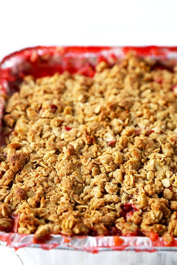 Strawberry Rhubarb Crisp - A strawberry and rhubarb crisp that's both sweet and tart and topped with a generous layer of crispy crumble. It's the perfect spring and summer dessert that pairs well with a scoop of vanilla ice cream! Recipe, dessert, fruit, healthy, crumble | pickledplum.com