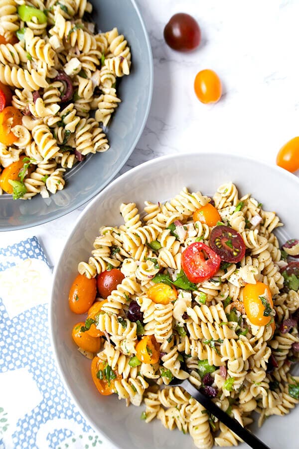 Italian Pasta Salad - Serve this bright, sweet and tangy Italian pasta salad at your next barbecue. It's the perfect summer salad filled with veggies, black olives, turkey and cheese, with a homemade Italian dressing so delicious you'll want to use it on everything! Recipe, salad, healthy pasta salad, tomato salad | pickledplum.com
