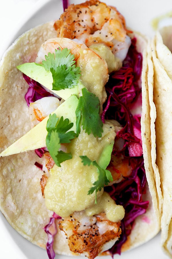 Shrimp Tacos with Tomatillo Sauce - Who knew it was this easy to make unforgettable shrimp tacos topped with colorful, refreshing and tasty toppings! Not only are these tacos healthy, they are addictive! Recipe, Mexican, tacos, seafood, healthy | pickledplum.com