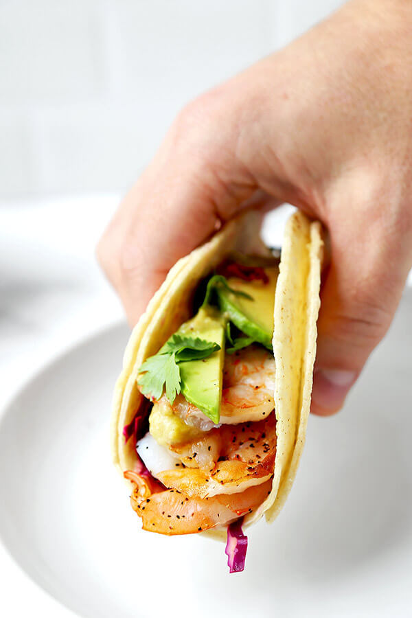 Shrimp Tacos with Tomatillo Sauce - Who knew it was this easy to make unforgettable shrimp tacos topped with colorful, refreshing and tasty toppings! Not only are these tacos healthy, they are addictive! Recipe, Mexican, tacos, seafood, healthy | pickledplum.com