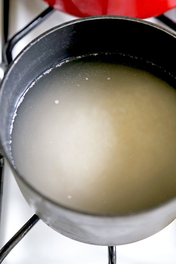 cooking rice in a pot on the stove