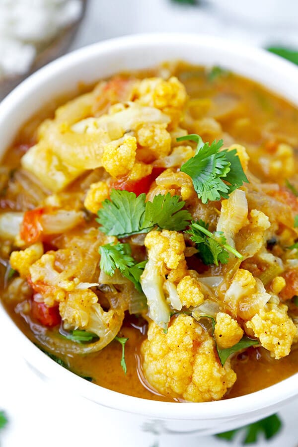 Thai Yellow Curry - Like it spicy? This pungent and fiery Thai Yellow Curry With Cauliflower is loaded with bold and authentic Southeast Asian flavors. vegetable curry recipe, plant based curry recipe, Thai dinner recipe, healthy cauliflower recipes | pickledplum.com