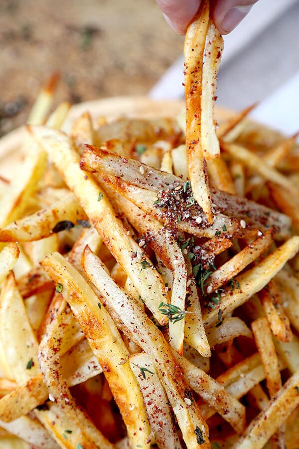 Oven Baked Za'atar Fries - These are the best oven baked fries you've ever tasted! Tossed in a homemade za'atar spice mix, they are salty, lemony, peppery and loaded with fresh herbs - plus, they are healthy too! healthy french fries recipe, healthy potato recipe, homemade za'atar seasoning, healthy snack, healthy vegan snack | pickledplum.com 