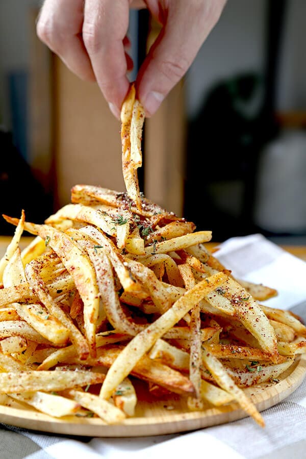 Oven Baked Za'atar Fries - These are the best oven baked fries you've ever tasted! Tossed in a homemade za'atar spice mix, they are salty, lemony, peppery and loaded with fresh herbs - plus, they are healthy too! healthy french fries recipe, healthy potato recipe, homemade za'atar seasoning, healthy snack, healthy vegan snack | pickledplum.com 