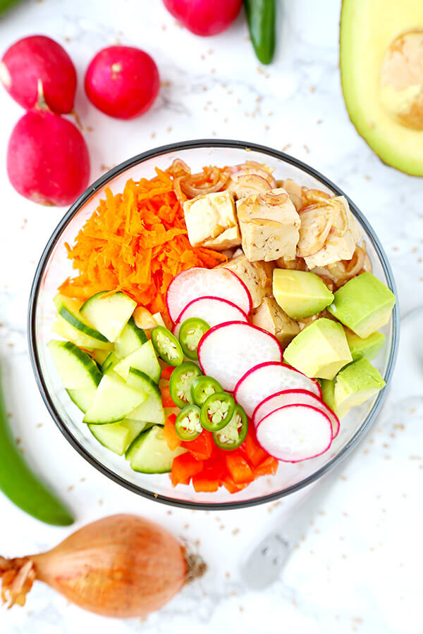 Tofu & Vegetable Poke Bowl - Bring a Hawaiian breeze into your kitchen with this vibrant tofu and vegetable poke bowl. Plant based, hawaiian poke bowl recipe, vegan poke bowl, tofu recipes healthy | pickledplum.com