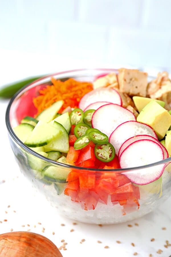 Tofu & Vegetable Poke Bowl - Bring a Hawaiian breeze into your kitchen with this vibrant tofu and vegetable poke bowl. Plant based, hawaiian poke bowl recipe, vegan poke bowl, tofu recipes healthy | pickledplum.com