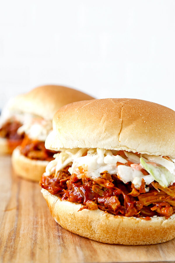 Vegan Jackfruit Pulled Pork Sandwiches - Skip the meat, extra fat and calories with a dreamy barbecue pulled jackfruit sandwich. This smoky, sweet and tangy sandwich is proof that plant based food can be just as delicious as the real thing! plant based recipes, vegan sandwich recipes, healthy vegan recipes, healthy super bowl recipes | pickledplum.com