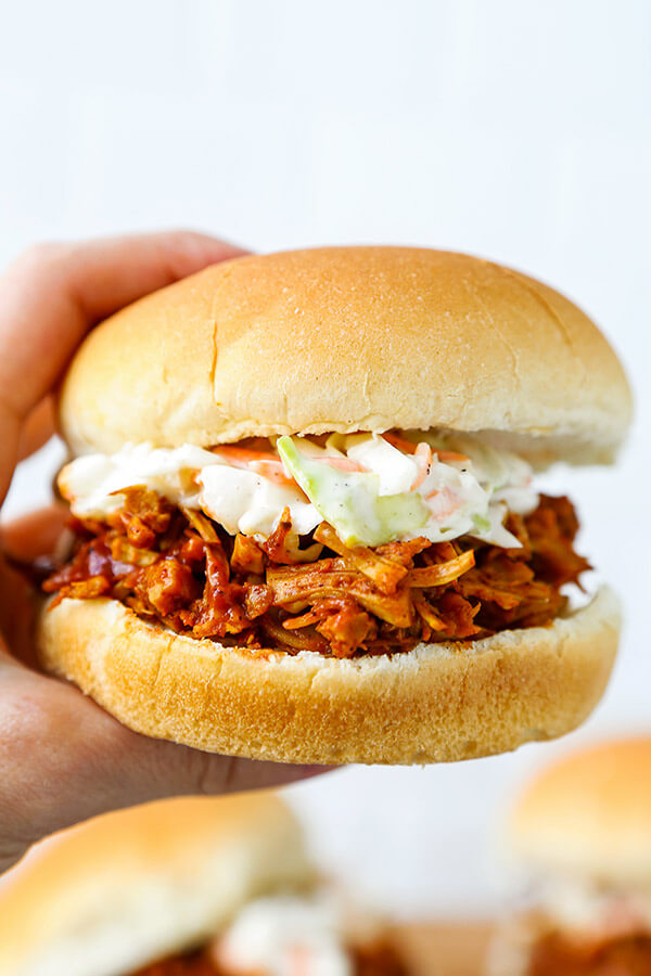 Barbecue Pulled Jackfruit Sandwiches - Skip the meat, extra fat and calories with a dreamy barbecue pulled jackfruit sandwich. This smoky, sweet and tangy sandwich is proof that plant based food can be just as delicious as the real thing! plant based recipes, vegan sandwich recipes, healthy vegan recipes, healthy super bowl recipes | pickledplum.com