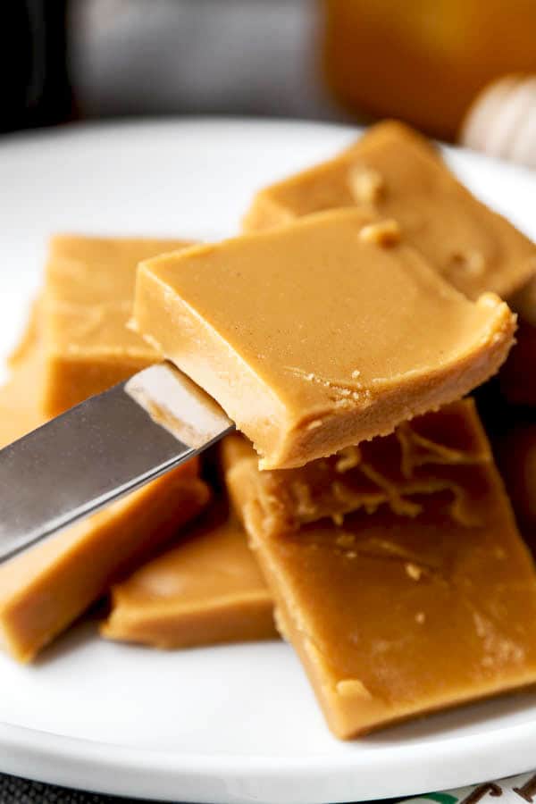 Peanut Butter & Honey Fudge - This healthier fudge recipe contains half the amount sugar and is made with raw organic honey and natural peanut butter. You won't believe how good it is! easy fudge recipe, vegetarian fudge recipe, healthy dessert recipes, desserts for parties, healthy clean eating desserts | pickledplum.com 