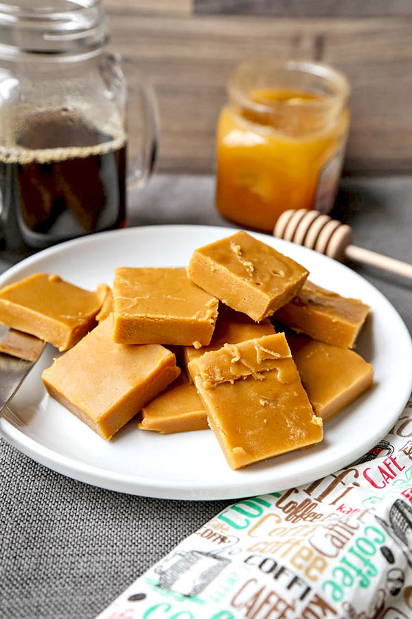 Peanut Butter & Honey Fudge - This healthier fudge recipe contains half the amount sugar and is made with raw organic honey and natural peanut butter. You won't believe how good it is! easy fudge recipe, vegetarian fudge recipe, healthy dessert recipes, desserts for parties, healthy clean eating desserts | pickledplum.com 