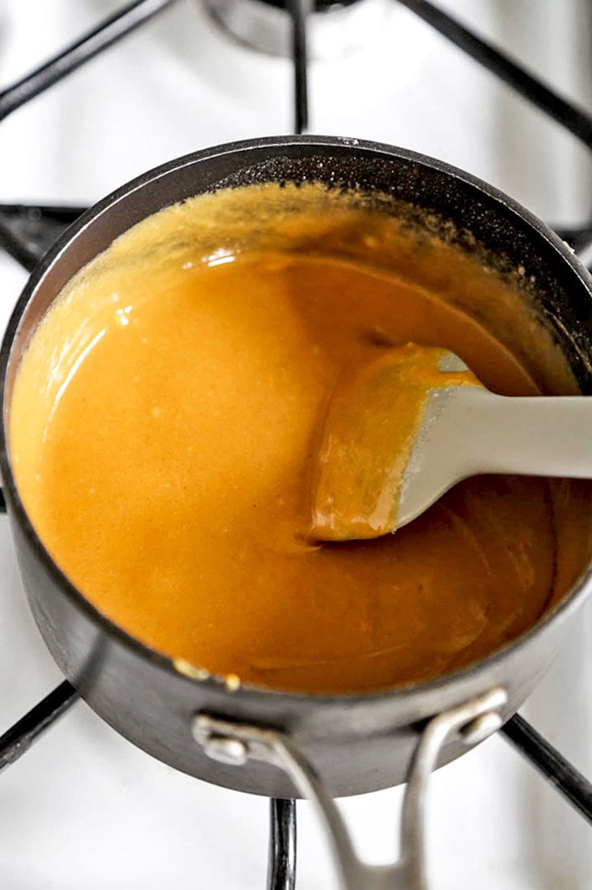 melted peanut butter in a pot