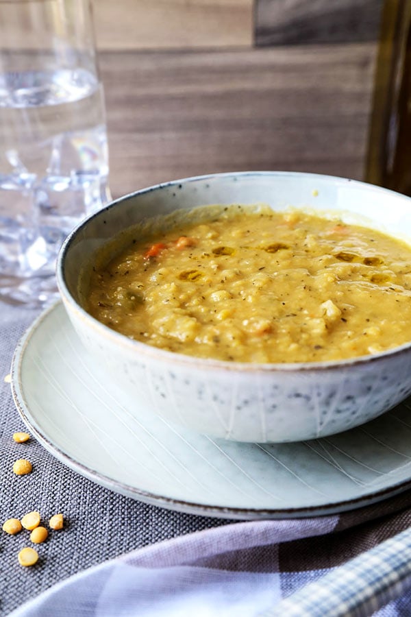 Vegetarian Split Pea Soup Recipe - This is a healthy and comforting vegetarian split pea soup recipe. Learn how to make it on a stove top or in a slow cooker with just 10 ingredients! #vegansplitpeasoup #healthyrecipes #meatless #glutenfree | pickledplum.com 