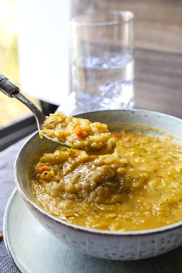 Vegetarian Split Pea Soup Recipe - This is a healthy and comforting vegetarian split pea soup recipe. Learn how to make it on a stove top or in a slow cooker with just 10 ingredients! #vegansplitpeasoup #healthyrecipes #meatless #glutenfree | pickledplum.com 