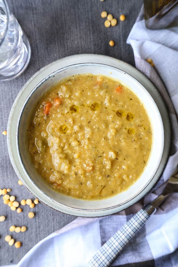 Vegetarian Split Pea Soup Recipe - This is a healthy and comforting vegetarian split pea soup recipe. Learn how to make it on a stove top or in a slow cooker with just 10 ingredients! #vegansplitpeasoup #healthyrecipes #meatless #glutenfree | pickledplum.com 