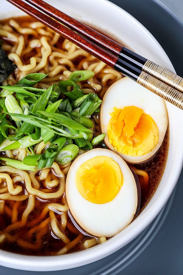 Sliced Ramen egg inside a bowl of shoyu ramen.