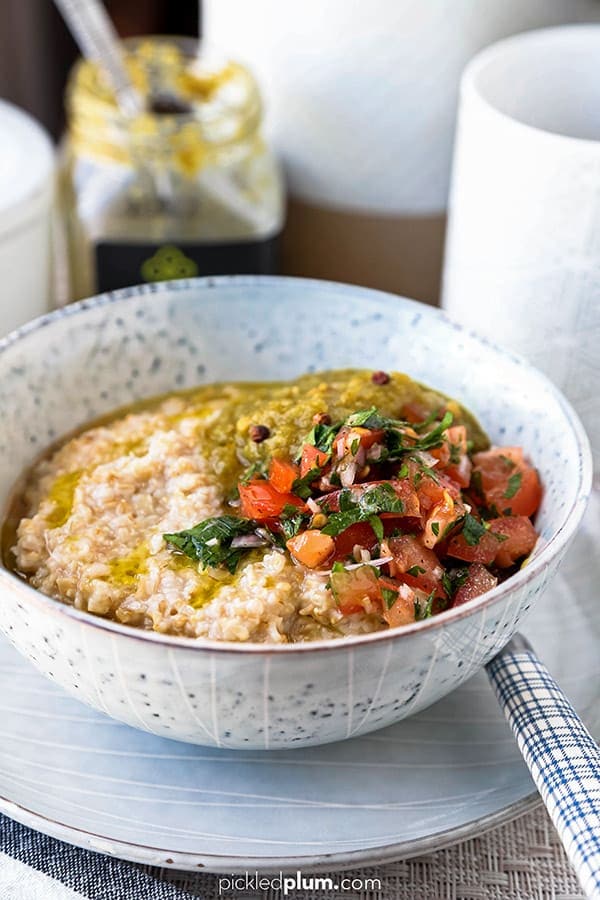 Harissa Spiced Moroccan Oatmeal Recipe - This is a savory oatmeal recipe you will love! A healthy breakfast that only take 10 minutes to make. You can use steel coat oatmeal, rolled oats, even hot breakfast cereal for this easy recipe! Top it with an egg or make it vegan, it's delicious both ways. #oatmeal #breakfastrecipes #moroccan #healthyrecipes | pickledplum.com 