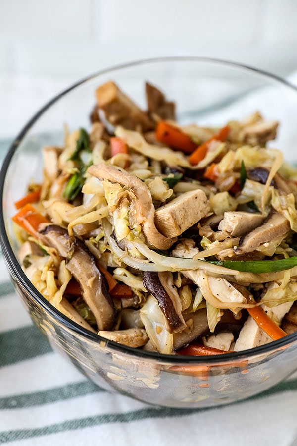 Mu Shoo Tofu Recipe - This post is a healthy vegetarian moo shu tofu, packed with vegetables and tossed in a sweet and savory sauce. You can use tortillas or lettuce wraps to act as a pancake for this quick stir fry. Homemade Chinese Food made healthier and ready in just 20 minutes! #chinesefood #stirfry #healthyeating #vegetables #tofu | pickledplum.com