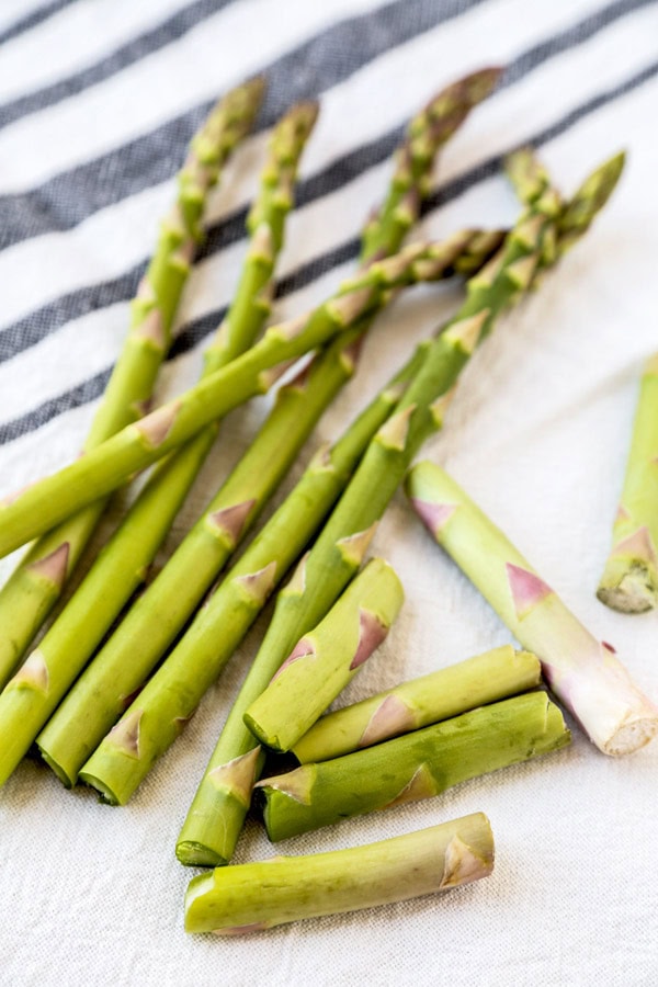 How To Cook Asparagus - Find out how to cook asparagus in the oven, on the stove, in a pan, skillet, on the grill, steamed, air fryer and in the microwave! Make healthy and easy meal by choosing your favorite cooking method, whether you want soft or crunchy asparagus! #asparagus #howtocook #healthyeating #cookingtips | pickledplum.com