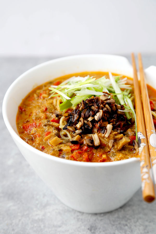 Vegan tantanmen recipe - Ditch the pork and make yourself and healthier bowl of tantanmen today! Earthy mushrooms and sweet red bell peppers dance in a spicy, savory and nutty broth packed with umami. This is one dish you will want to add to your meatless meal rotation! Ready in 25 minutes from start to finish. #ramen #recipes #vegan #vegetarian | pickledplum.com