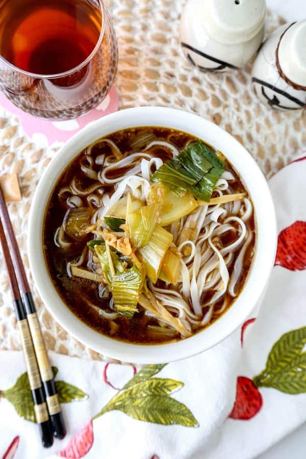 Baby bok choy soup with garlic and ginger - This hot and savory Baby Bok Choy Soup With Garlic and Ginger is summer eating at its best. Loaded with rice noodles, this fragrant Asian soup recipe is easy to make and packed with deep, umami flavor. #souprecipe #healthyeating #noodlesoup #ginger | pickledplum.com