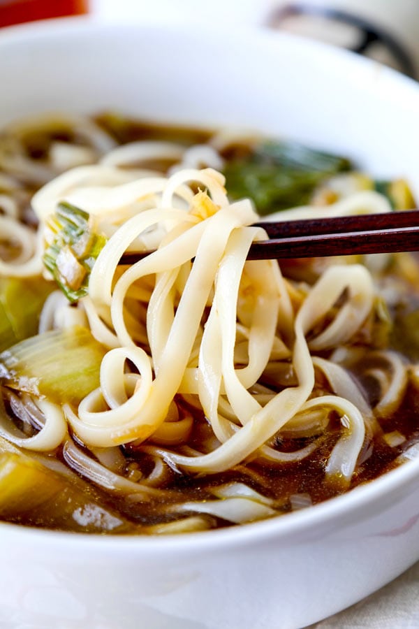 Baby bok choy soup with garlic and ginger - This hot and savory Baby Bok Choy Soup With Garlic and Ginger is summer eating at its best. Loaded with rice noodles, this fragrant Asian soup recipe is easy to make and packed with deep, umami flavor. #souprecipe #healthyeating #noodlesoup #ginger | pickledplum.com