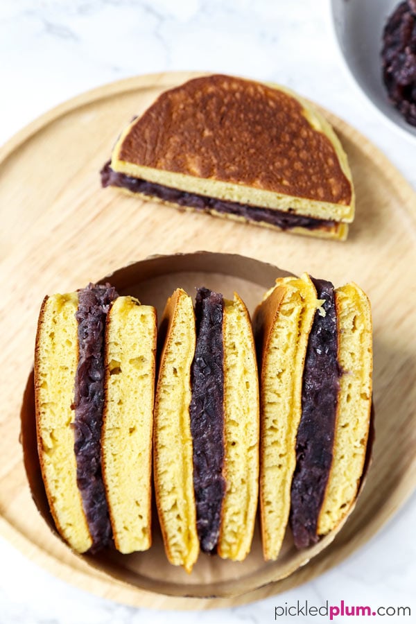 Dorayaki (Japanese pancakes with red bean paste) - This is a recipe for a traditional Japanese confection ((和菓子, wa-gashi)) called dorayaki. Dorayaki is a delicious sandwich-like treat made with two pancakes and filled with red bean paste. It's loved by kids and adults all across Japan. And by Doraemon too! #japaneserecipe #dessertrecipe #pancakes #japanesesweets | pickledplum.com