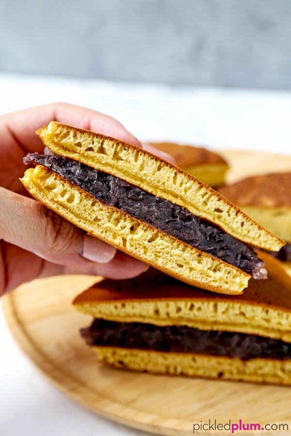 Dorayaki (Japanese pancakes with red bean paste) - This is a recipe for a traditional Japanese confection ((和菓子, wa-gashi)) called dorayaki. Dorayaki is a delicious sandwich-like treat made with two pancakes and filled with red bean paste. It's loved by kids and adults all across Japan. And by Doraemon too! #japaneserecipe #dessertrecipe #pancakes #japanesesweets | pickledplum.com