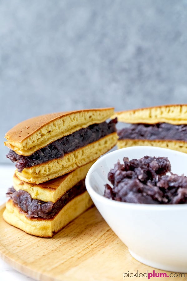 Dorayaki (Japanese pancakes with red bean paste) - This is a recipe for a traditional Japanese confection ((和菓子, wa-gashi)) called dorayaki. Dorayaki is a delicious sandwich-like treat made with two pancakes and filled with red bean paste. It's loved by kids and adults all across Japan. And by Doraemon too! #japaneserecipe #dessertrecipe #pancakes #japanesesweets | pickledplum.com