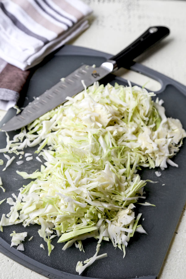 shredded cabbage on cutting board